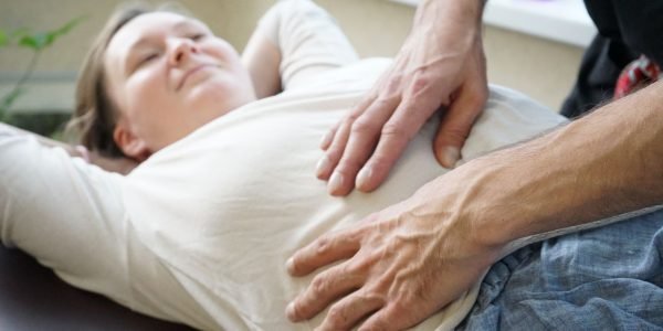 A woman receives a soothing massage, focusing on relaxation and wellness in a spa environment.